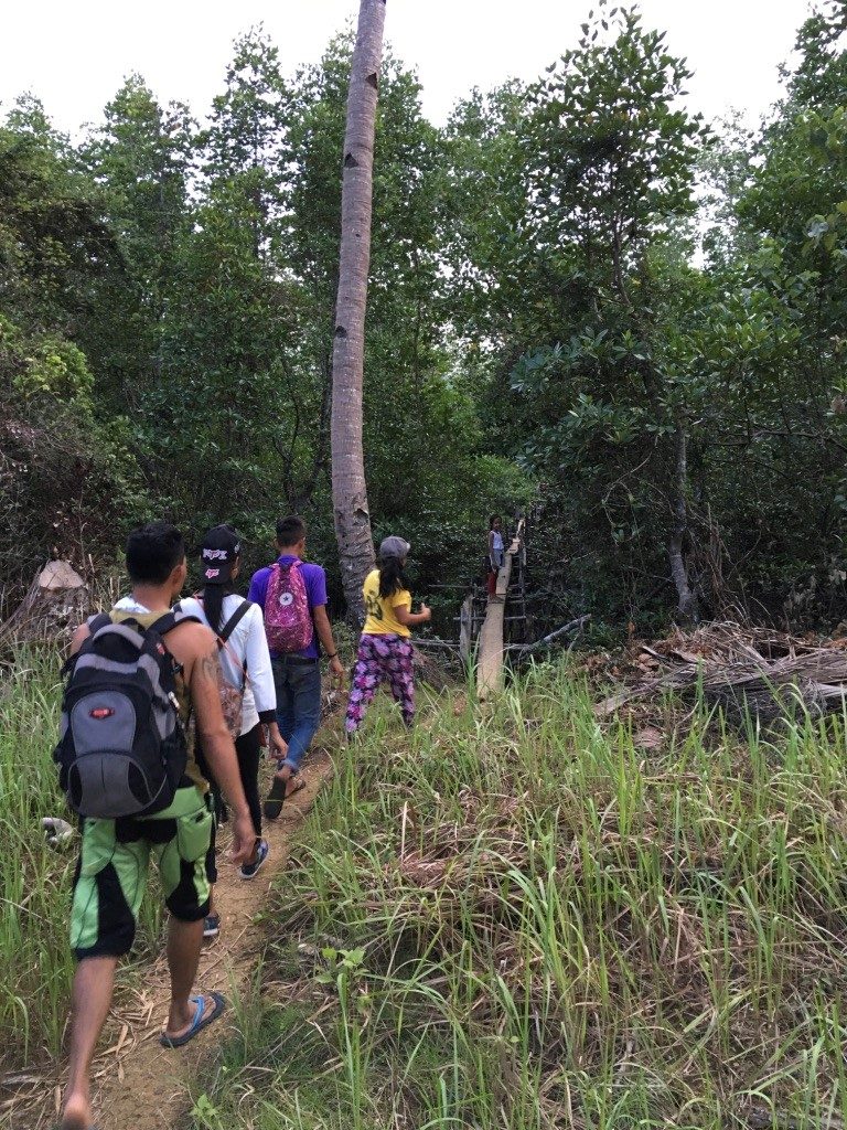 In Palawan, getting ready to cross the first of three very long bridges that I did NOT fall off of, Praise God!-Amy